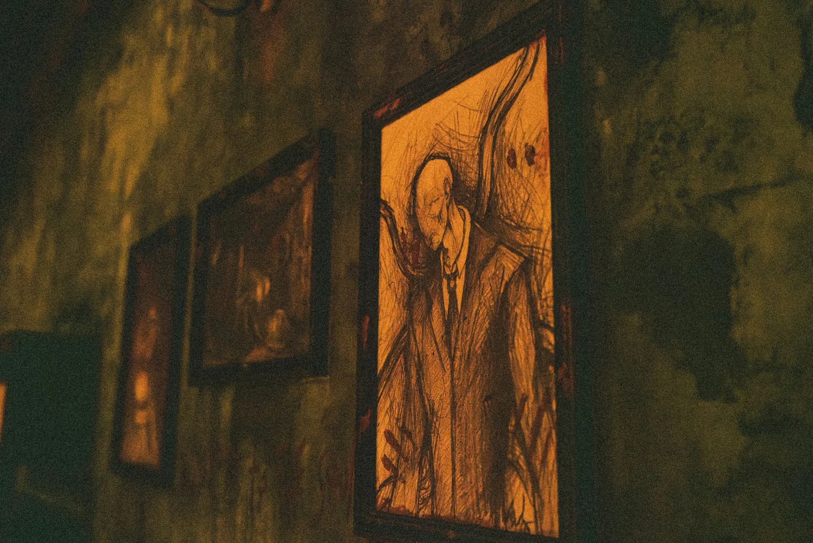 Unsettling sketched portraits hanging on the decaying walls of Atkins House